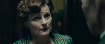 Movie still from “Beyond the Sea” (2004), directed by Kevin Spacey – An older woman is looking into the distance; Close Up shot, Low angle