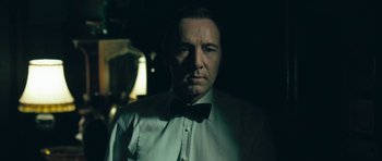 Movie still from “Beyond the Sea” (2004), directed by Kevin Spacey – A person wearing a suit and bow tie; Close Up shot, Low angle