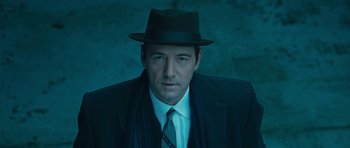 Movie still from “Beyond the Sea” (2004), directed by Kevin Spacey – A man wearing a hat and a tie; Close Up shot, Low angle