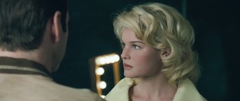 Movie still from “Beyond the Sea” (2004), directed by Kevin Spacey – A woman with blonde hair looking into the distance; Close Up shot, Over the shoulder angle