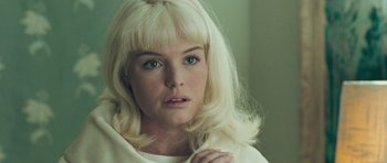 Movie still from “Beyond the Sea” (2004), directed by Kevin Spacey – A person with blonde hair; Close Up shot, Over the shoulder angle