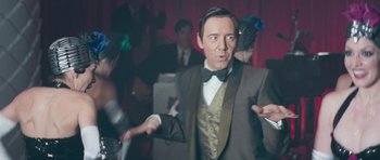 Movie still from “Beyond the Sea” (2004), directed by Kevin Spacey – A man in a suit and a bow tie; Close Up shot, Over the shoulder angle