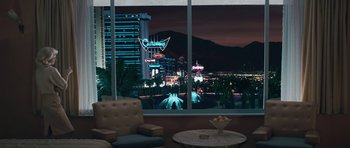 Movie still from “Beyond the Sea” (2004), directed by Kevin Spacey – A view of a city at night through a window; Extreme Wide shot, High angle