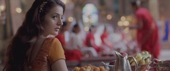 A woman sitting in front of a plate of food