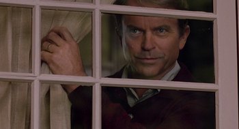 Movie still from “Bicentennial Man” (1999), directed by Chris Columbus – A man looking through a window at the camera; Close Up shot, Over the shoulder angle