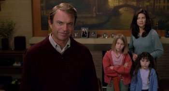 Movie still from “Bicentennial Man” (1999), directed by Chris Columbus – A man standing next to a girl in a room; Medium shot, Over the shoulder angle