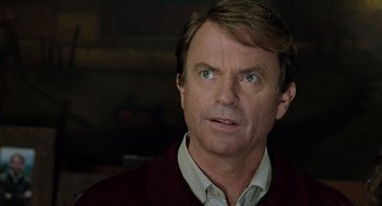 Movie still from “Bicentennial Man” (1999), directed by Chris Columbus – A person wearing a shirt and a sweater; Close Up shot, Over the shoulder angle