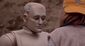 Movie still from “Bicentennial Man” (1999), directed by Chris Columbus – The face of a robot; Close Up shot, Over the shoulder angle