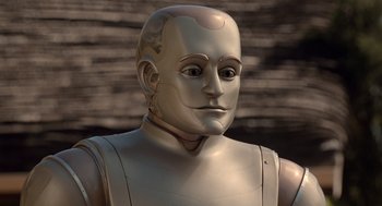 Movie still from “Bicentennial Man” (1999), directed by Chris Columbus – An image of a robot that is looking at the camera; Close Up shot, High angle