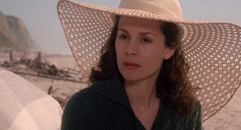 Movie still from “Bicentennial Man” (1999), directed by Chris Columbus – A person wearing a hat; Close Up shot, Over the shoulder angle