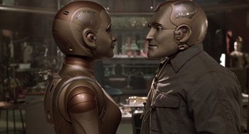 Movie still from “Bicentennial Man” (1999), directed by Chris Columbus – A man and a woman standing next to each other; Close Up shot, Over the shoulder angle