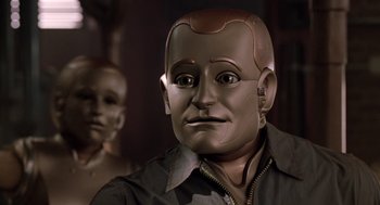 Movie still from “Bicentennial Man” (1999), directed by Chris Columbus – The face of a robot; Close Up shot, Over the shoulder angle