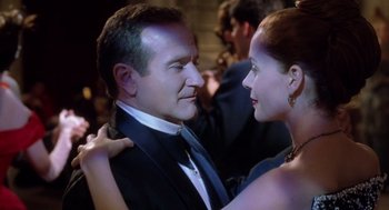 Movie still from “Bicentennial Man” (1999), directed by Chris Columbus – A man and a woman dancing together in a room; Close Up shot, Over the shoulder angle