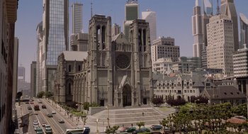 Movie still from “Bicentennial Man” (1999), directed by Chris Columbus – A large church with a clock on the front of the building; Extreme Wide shot, High angle