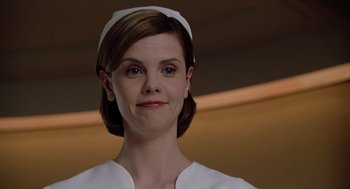 Movie still from “Bicentennial Man” (1999), directed by Chris Columbus – A person wearing a nurse's uniform; Close Up shot, Low angle