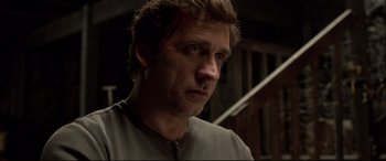 A person wearing a gray shirt