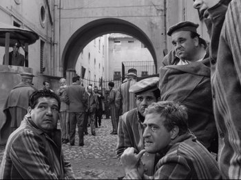 Movie still from “Big Deal on Madonna Street” (1958), directed by Mario Monicelli – A black and white photo of a group of men; Medium shot, High angle