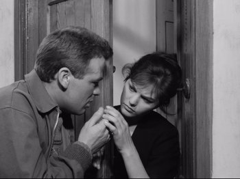 Movie still from “Big Deal on Madonna Street” (1958), directed by Mario Monicelli – A man and a woman looking at one another; Close Up shot, High angle