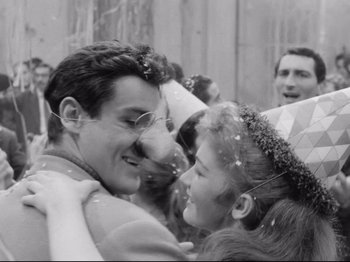 Movie still from “Big Deal on Madonna Street” (1958), directed by Mario Monicelli – A man and a woman are hugging each other; Close Up shot, High angle