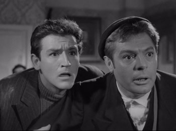 Movie still from “Big Deal on Madonna Street” (1958), directed by Mario Monicelli – A man and a woman are looking at the camera; Close Up shot, Low angle