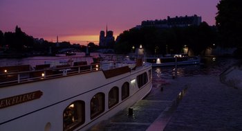Movie still from “Big Fish” (2003), directed by Tim Burton – A boat is docked in a harbor at night; Extreme Wide shot, High angle