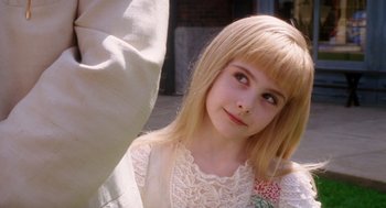 Movie still from “Big Fish” (2003), directed by Tim Burton – A young girl in a white lace dress; Close Up shot, Over the shoulder angle