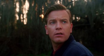 Movie still from “Big Fish” (2003), directed by Tim Burton – A person looking at the camera; Close Up shot, Low angle