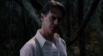 Movie still from “Big Fish” (2003), directed by Tim Burton – A person wearing a white shirt; Close Up shot, Low angle