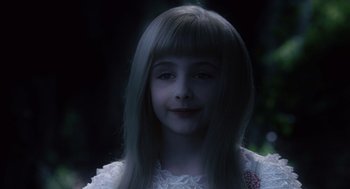Movie still from “Big Fish” (2003), directed by Tim Burton – A young girl with long hair and a white dress; Close Up shot, Over the shoulder angle