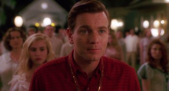 Movie still from “Big Fish” (2003), directed by Tim Burton – A person wearing a red shirt; Close Up shot, Over the shoulder angle