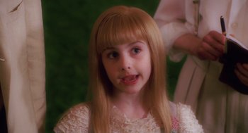 Movie still from “Big Fish” (2003), directed by Tim Burton – A young girl wearing a white dress and a blonde wig; Close Up shot, High angle