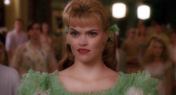 Movie still from “Big Fish” (2003), directed by Tim Burton – A person wearing a green dress; Close Up shot, Over the shoulder angle