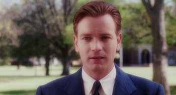 Movie still from “Big Fish” (2003), directed by Tim Burton – A person wearing a suit and tie; Close Up shot, Over the shoulder angle