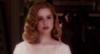 Movie still from “Big Fish” (2003), directed by Tim Burton – A young woman with red hair and a white shirt; Close Up shot, Over the shoulder angle
