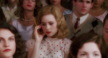 Movie still from “Big Fish” (2003), directed by Tim Burton – A woman in a polka dot dress talking on a cell phone; Close Up shot, High angle