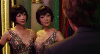 Movie still from “Big Fish” (2003), directed by Tim Burton – A woman is looking at herself in the mirror; Close Up shot, Over the shoulder angle