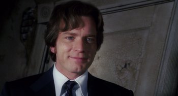 Movie still from “Big Fish” (2003), directed by Tim Burton – A person wearing a suit and tie; Close Up shot, Low angle