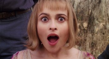 Movie still from “Big Fish” (2003), directed by Tim Burton – A person with a surprised look on their face; Close Up shot, Overhead angle
