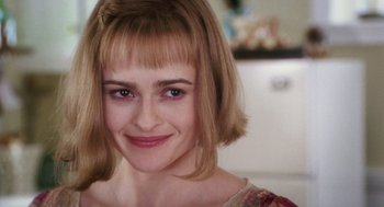 Movie still from “Big Fish” (2003), directed by Tim Burton – A person with blonde hair; Close Up shot, Over the shoulder angle