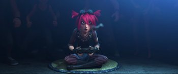 Movie still from “Big Hero 6” (2014), directed by Chris Williams – A woman sitting on the ground holding a game controller; Medium shot, High angle