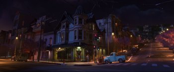 Movie still from “Big Hero 6” (2014), directed by Chris Williams – A night scene of a street corner in a city; Extreme Wide shot, High angle