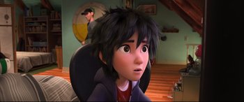 Movie still from “Big Hero 6” (2014), directed by Chris Williams – A young boy with black hair sitting in a chair; Close Up shot, High angle