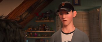Movie still from “Big Hero 6” (2014), directed by Chris Williams – A boy with a baseball cap is standing in front of a shelf; Close Up shot, Over the shoulder angle
