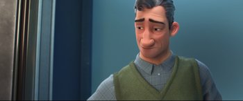 Movie still from “Big Hero 6” (2014), directed by Chris Williams – An animated man with grey hair wearing a green sweater; Close Up shot, Over the shoulder angle