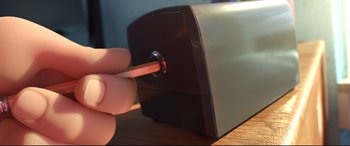 Movie still from “Big Hero 6” (2014), directed by Chris Williams – A hand is holding a pencil in front of an electronic device; Extreme Close Up shot, High angle
