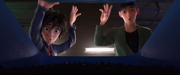 Movie still from “Big Hero 6” (2014), directed by Chris Williams – A couple of people standing next to each other in a room; Medium shot, Low angle