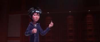 Movie still from “Big Hero 6” (2014), directed by Chris Williams – A person holding a microphone and pointing to a piece of paper; Close Up shot, Over the shoulder angle