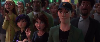 Movie still from “Big Hero 6” (2014), directed by Chris Williams – A group of people that are standing in a room; Close Up shot, Over the shoulder angle
