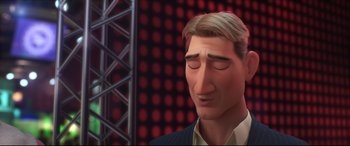 Movie still from “Big Hero 6” (2014), directed by Chris Williams – A man with his eyes closed in front of a red background; Close Up shot, Low angle