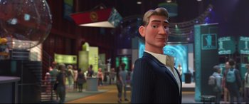 Movie still from “Big Hero 6” (2014), directed by Chris Williams – A man in a business suit standing in front of a crowd; Close Up shot, Over the shoulder angle